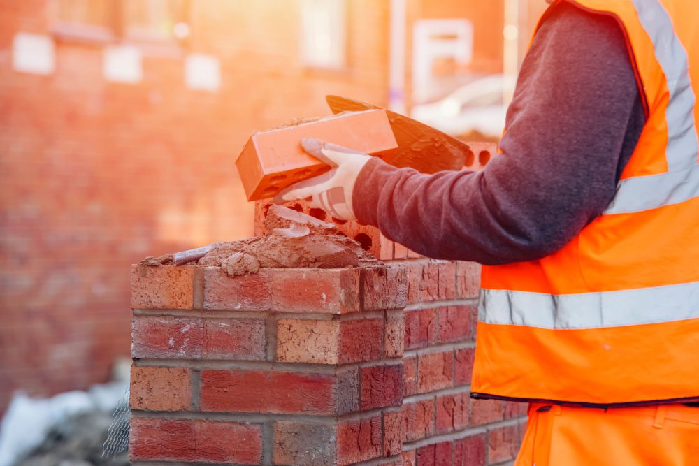 A bricklayer working on a new-build home.