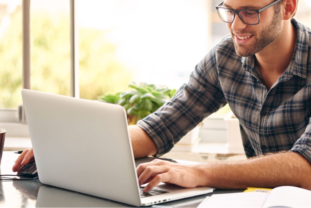 A man using a laptop.