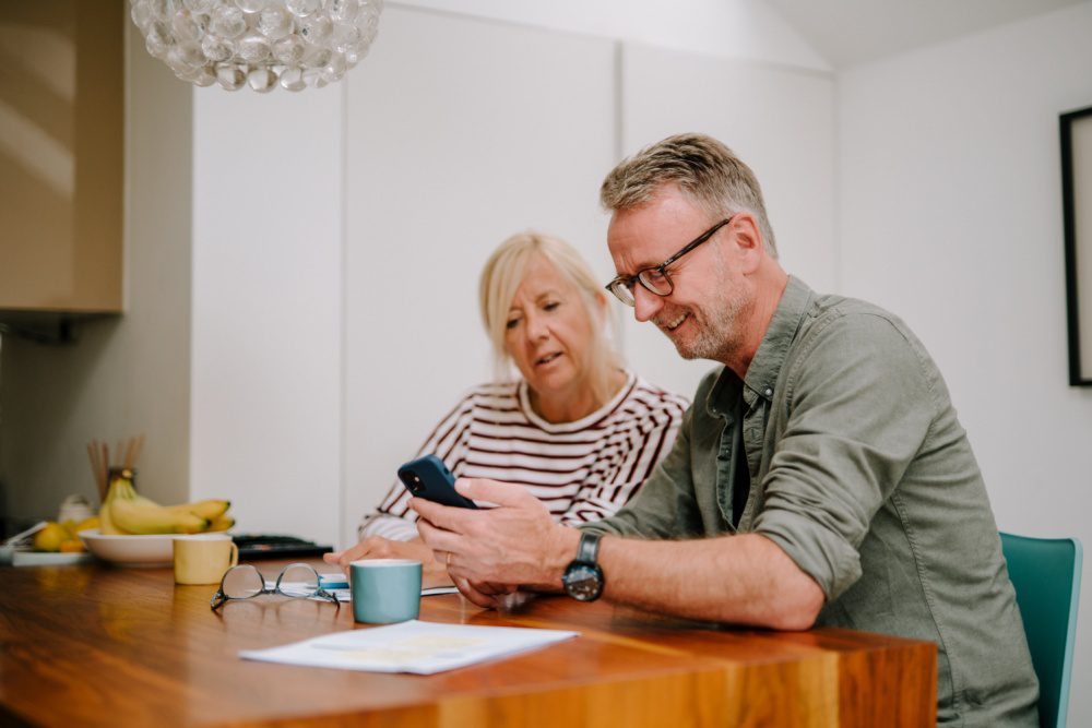 A couple going through paperwork together.