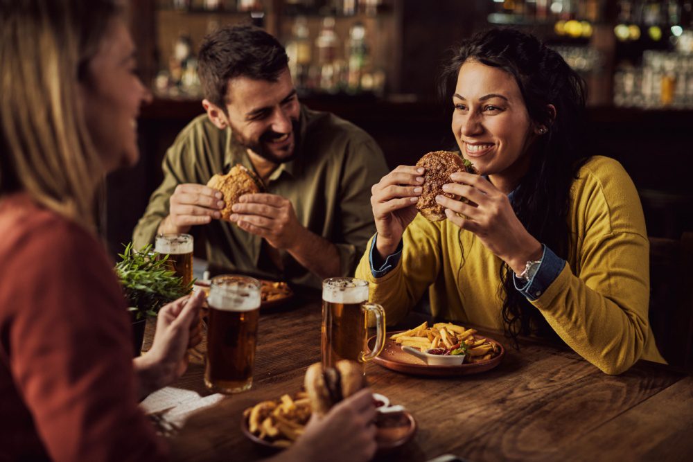 A group of friends having dinner in a pub.